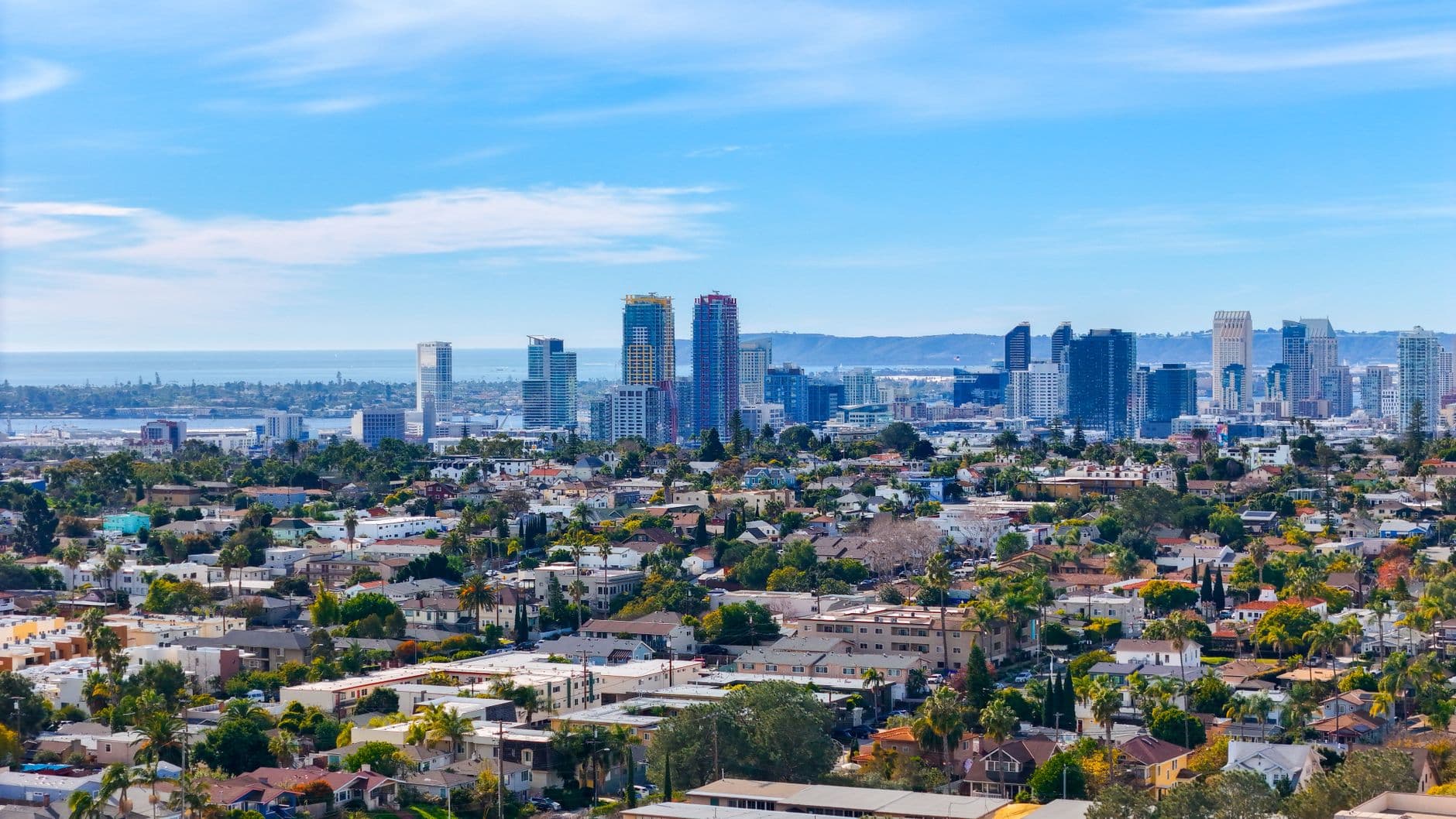 Stunning aerial cityscape of downtown San Diego featuring urban skyline and suburban sprawl.