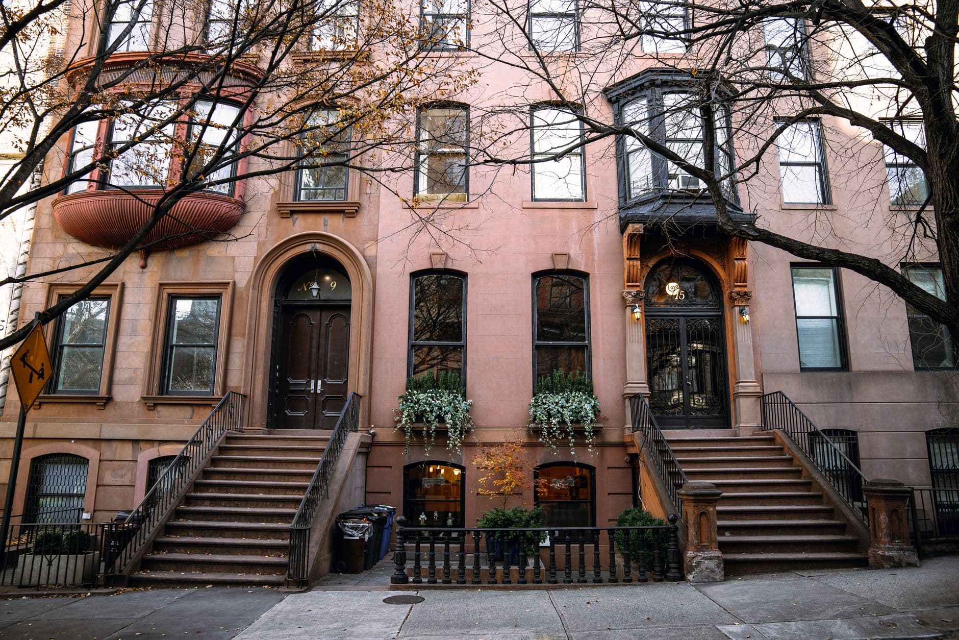 Brownstone buildings in Brooklyn, New York, showcasing autumn charm.